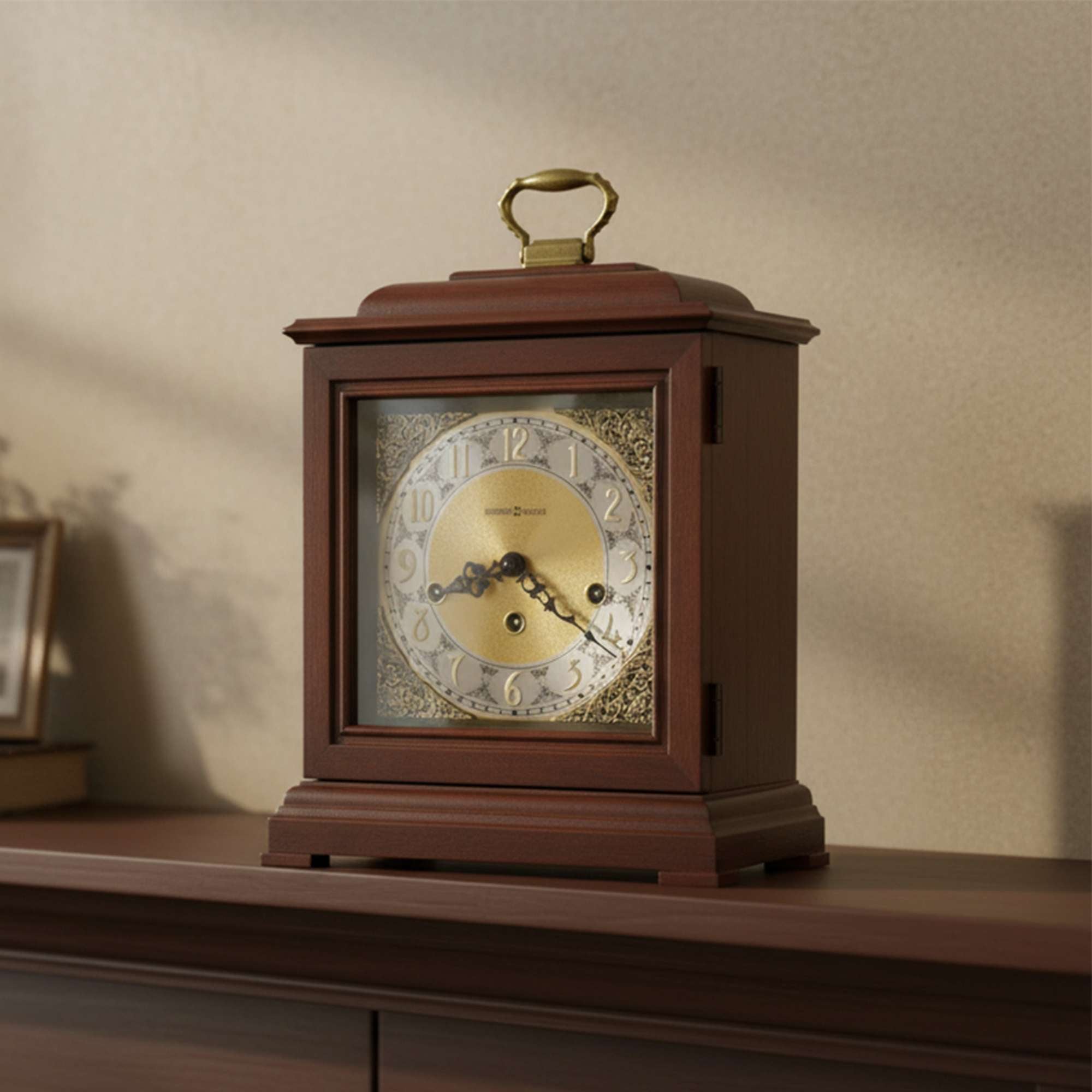 A classic wooden mantel clock with a gold dial and ornate detailing.
