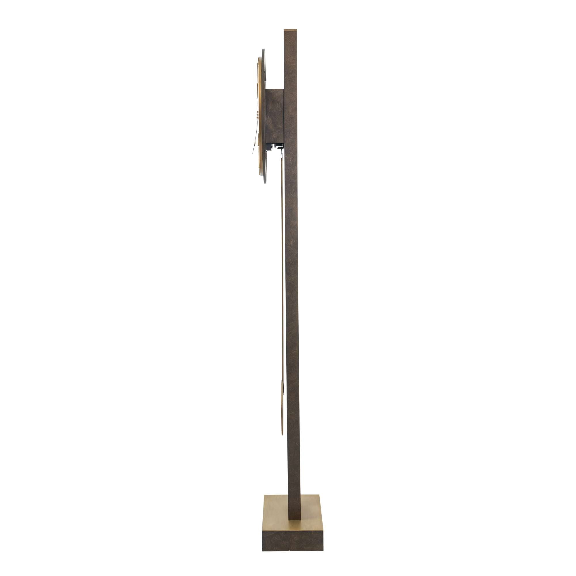 Side view of a modern wall clock mounted on a sleek stand.