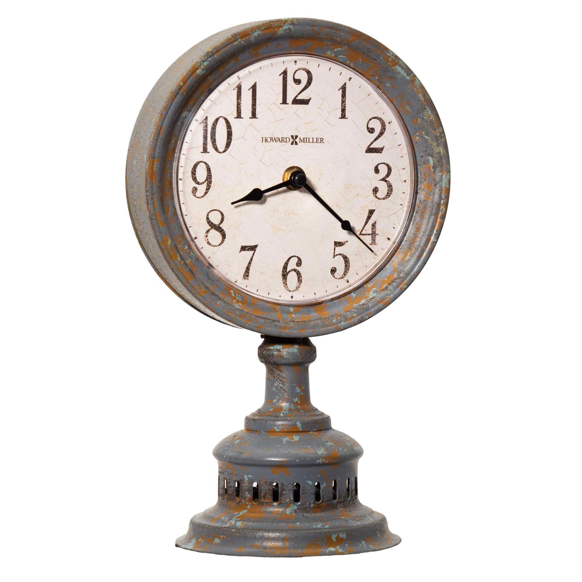 A vintage-style clock with a round face and a distressed blue finish on a decorative base.