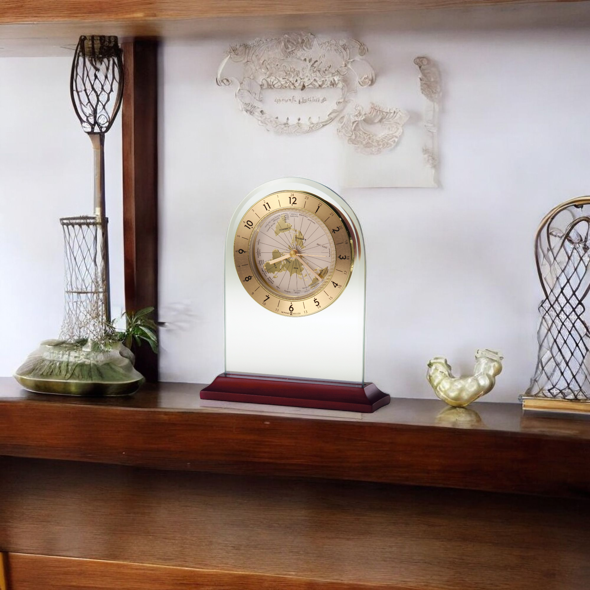 A decorative clock displayed on a wooden shelf with various items.
