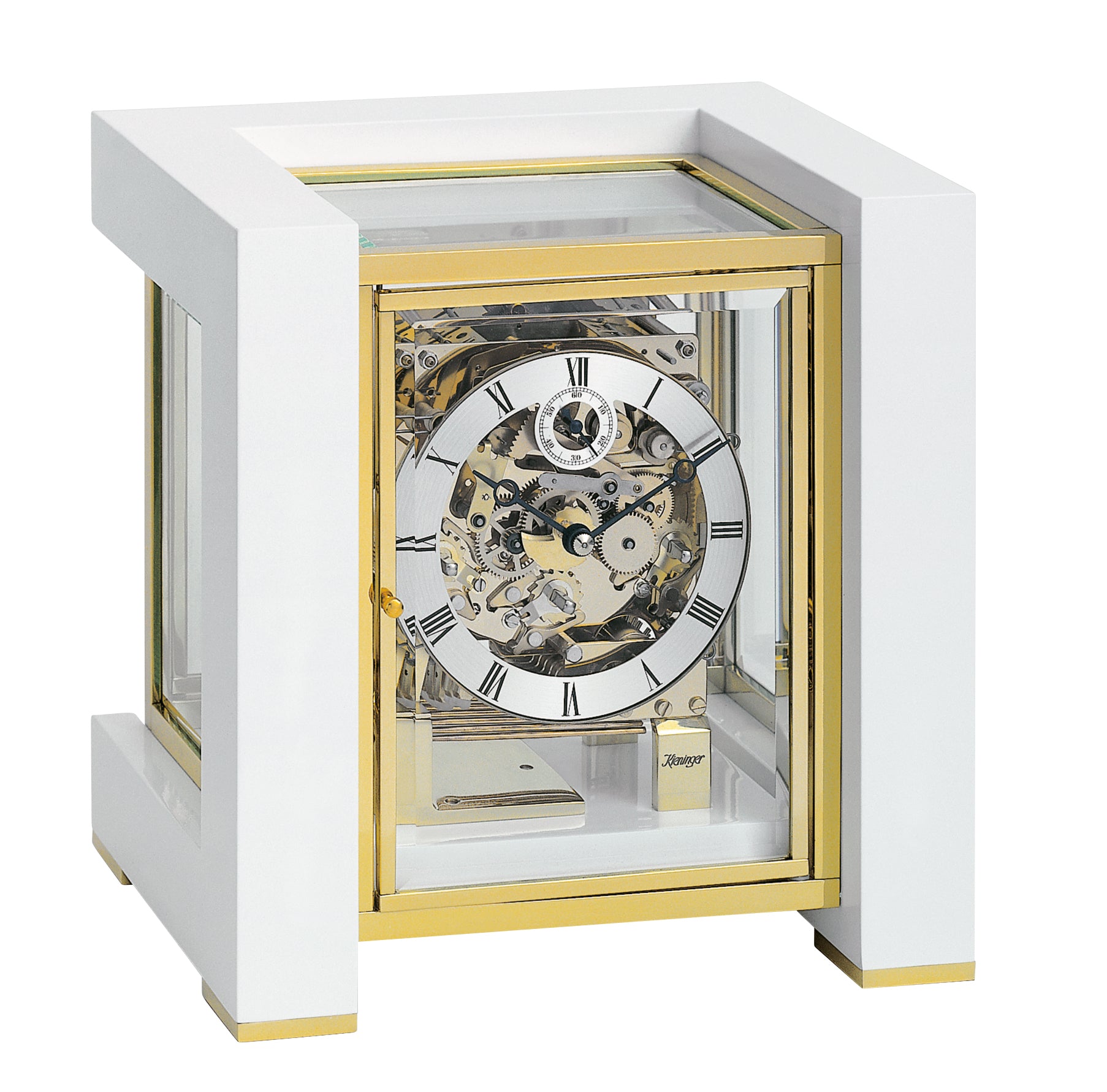 A vintage mechanical clock with a transparent casing and gold accents.