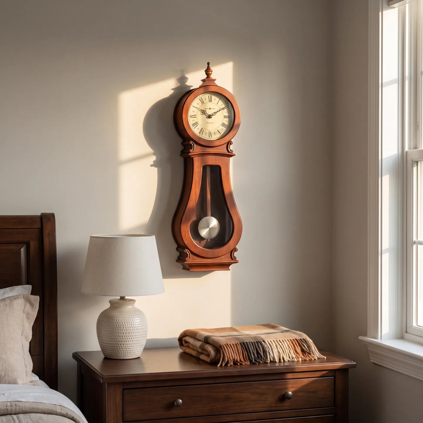 Howard Miller Arendal Wall Clock, 30-inch, on the wall in a styled room