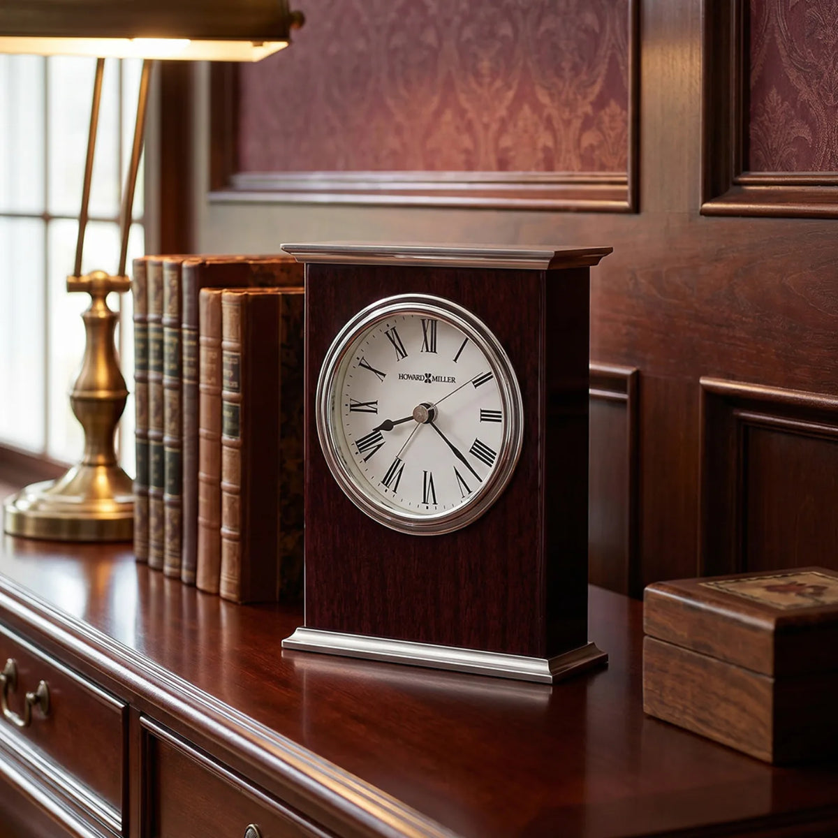 Howard Miller Kentwood Tabletop Clock, 6-inch, on a shelf in a styled room