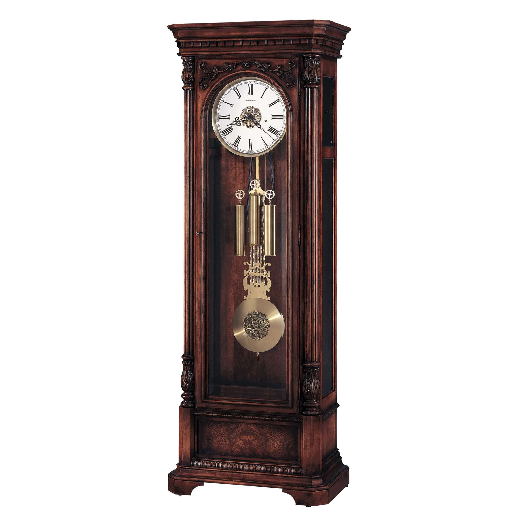 A vintage wooden grandfather clock with a white clock face and ornate pendulum.