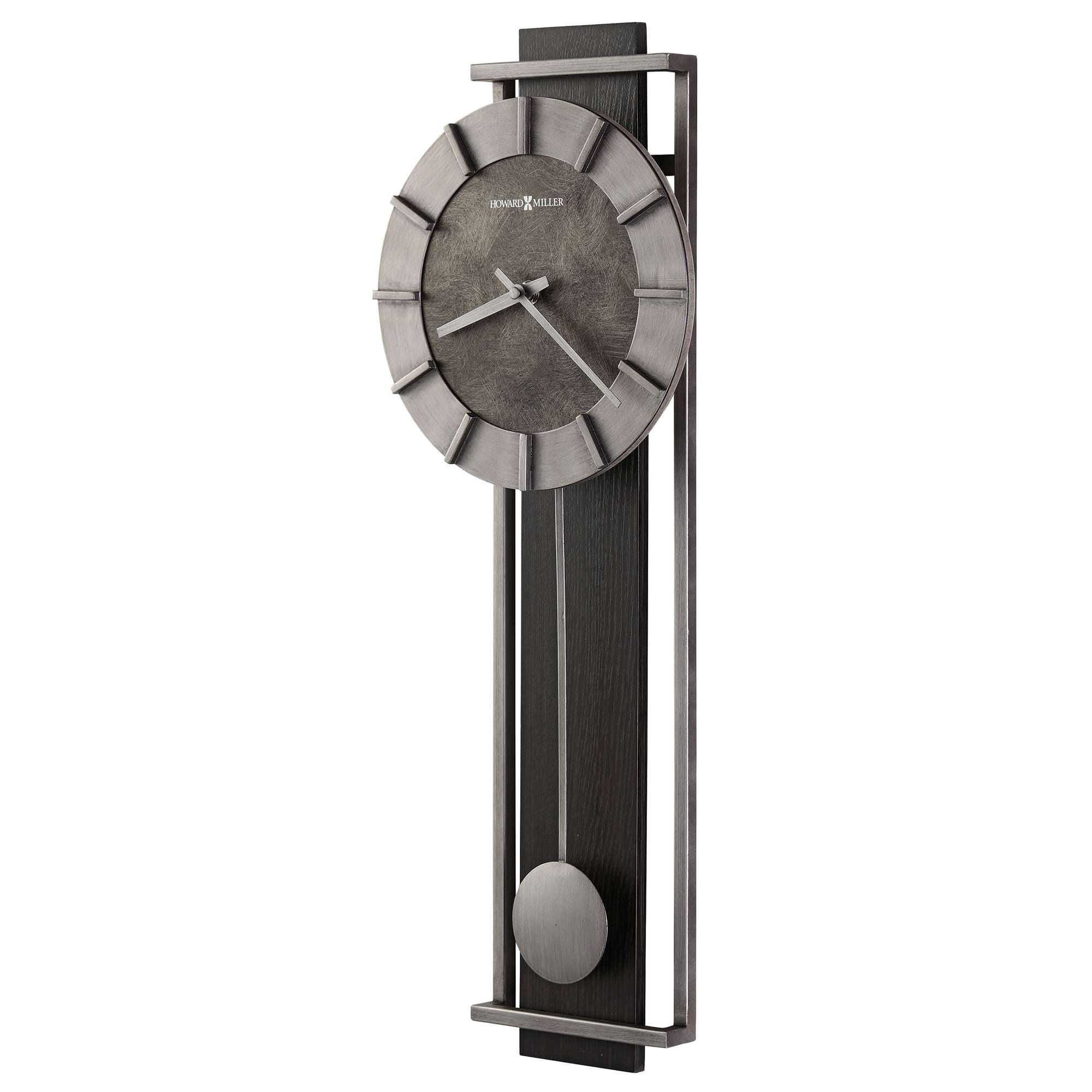 Modern wall clock with a circular face and a sleek, elongated design.