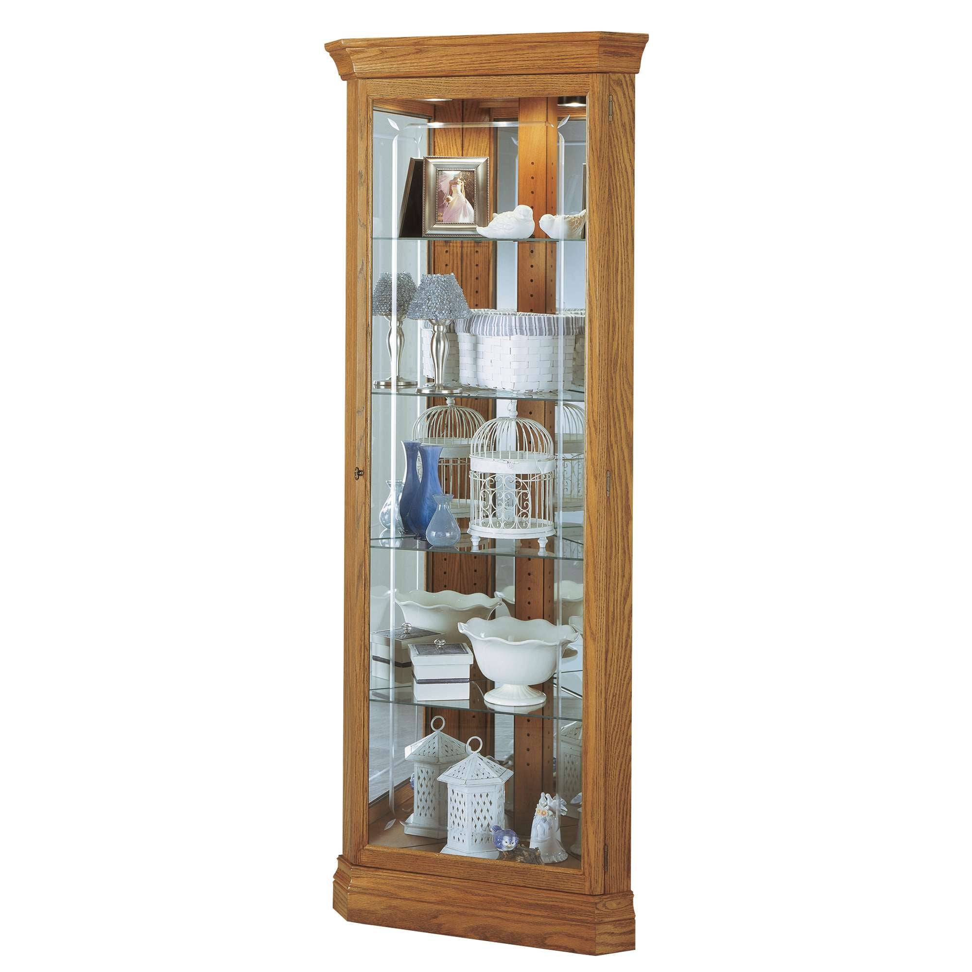 Tall glass display cabinet showcasing various decorative items.