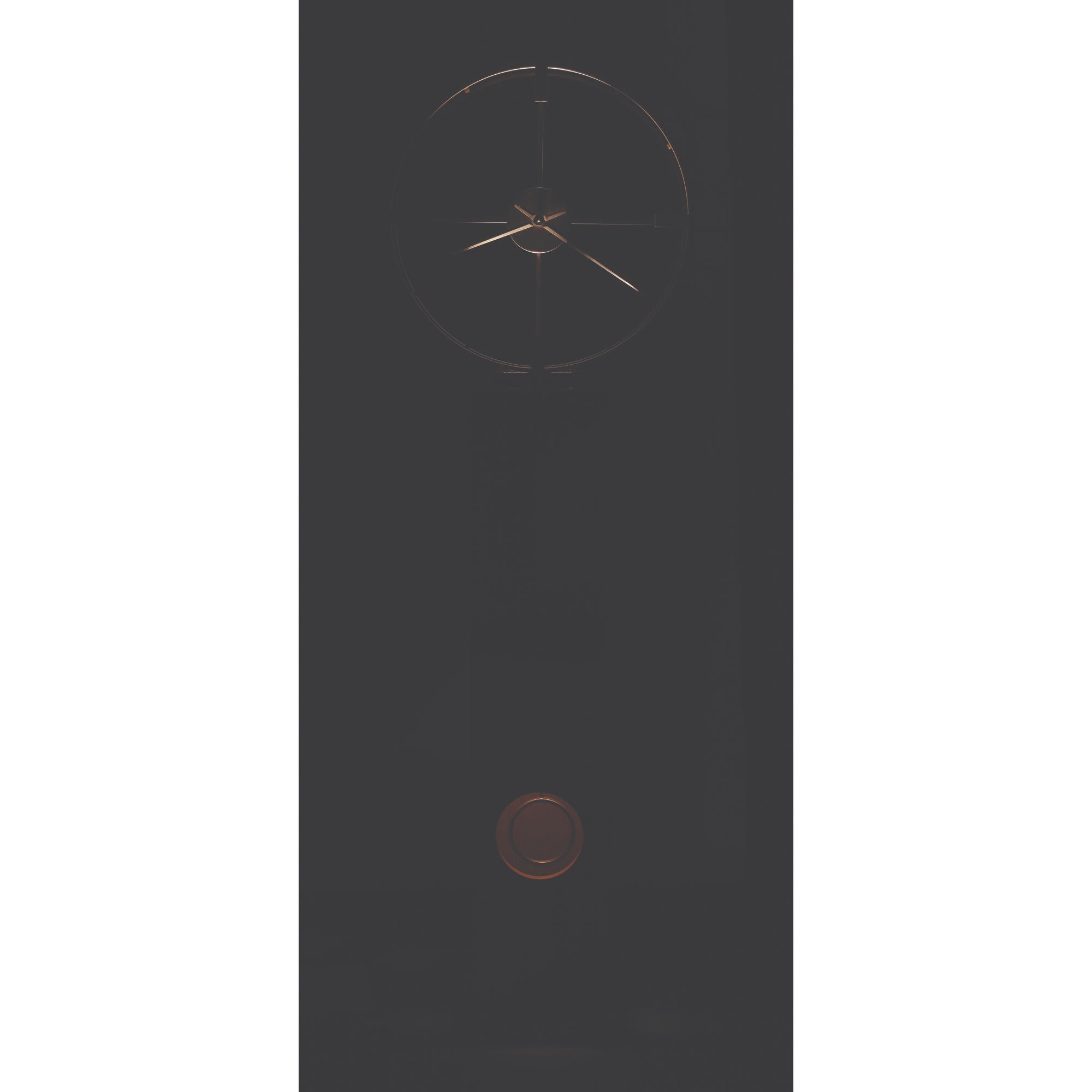 A minimalist clock with a dark background and rose gold accents.