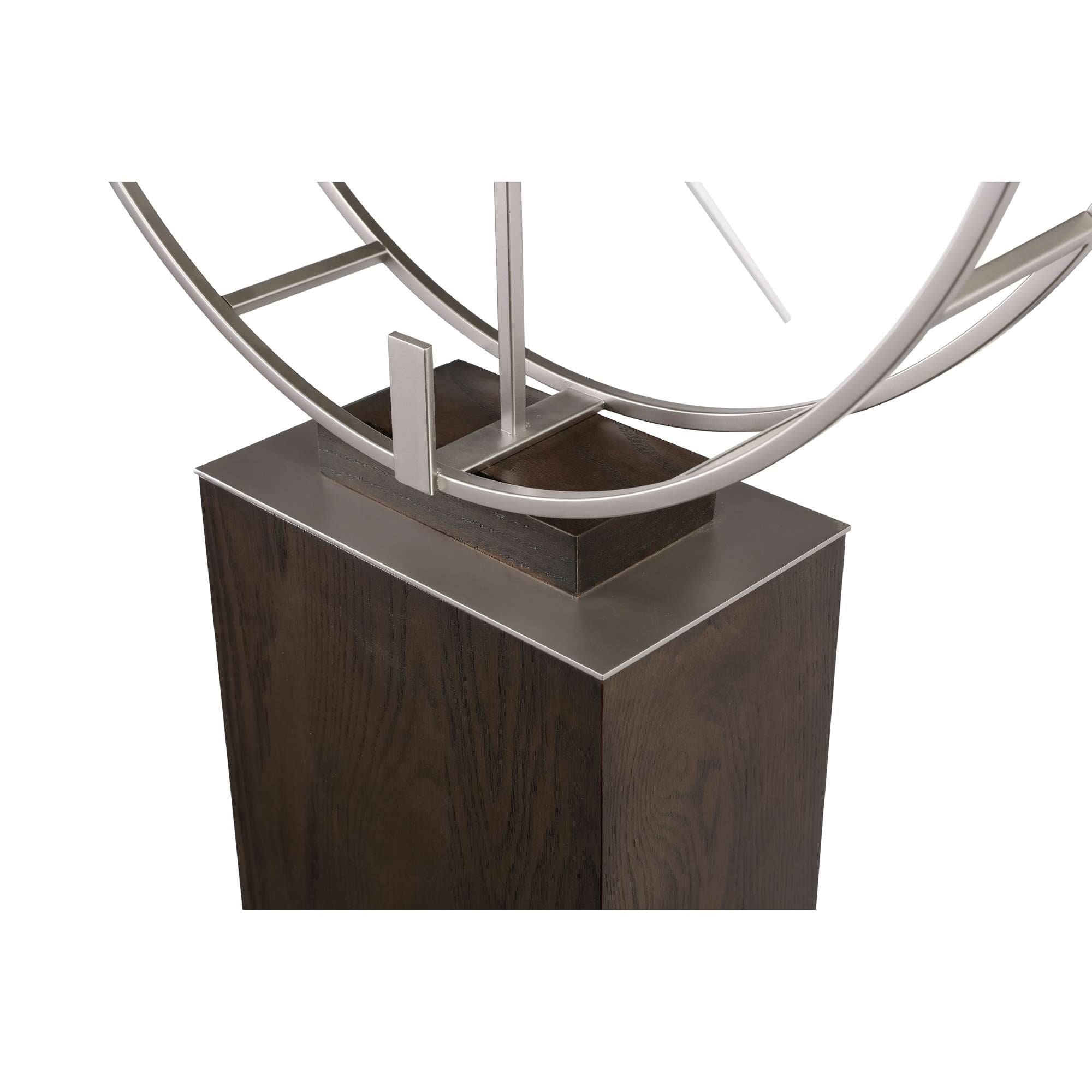 A modern decorative sculpture featuring curved metallic elements atop a dark wooden base.