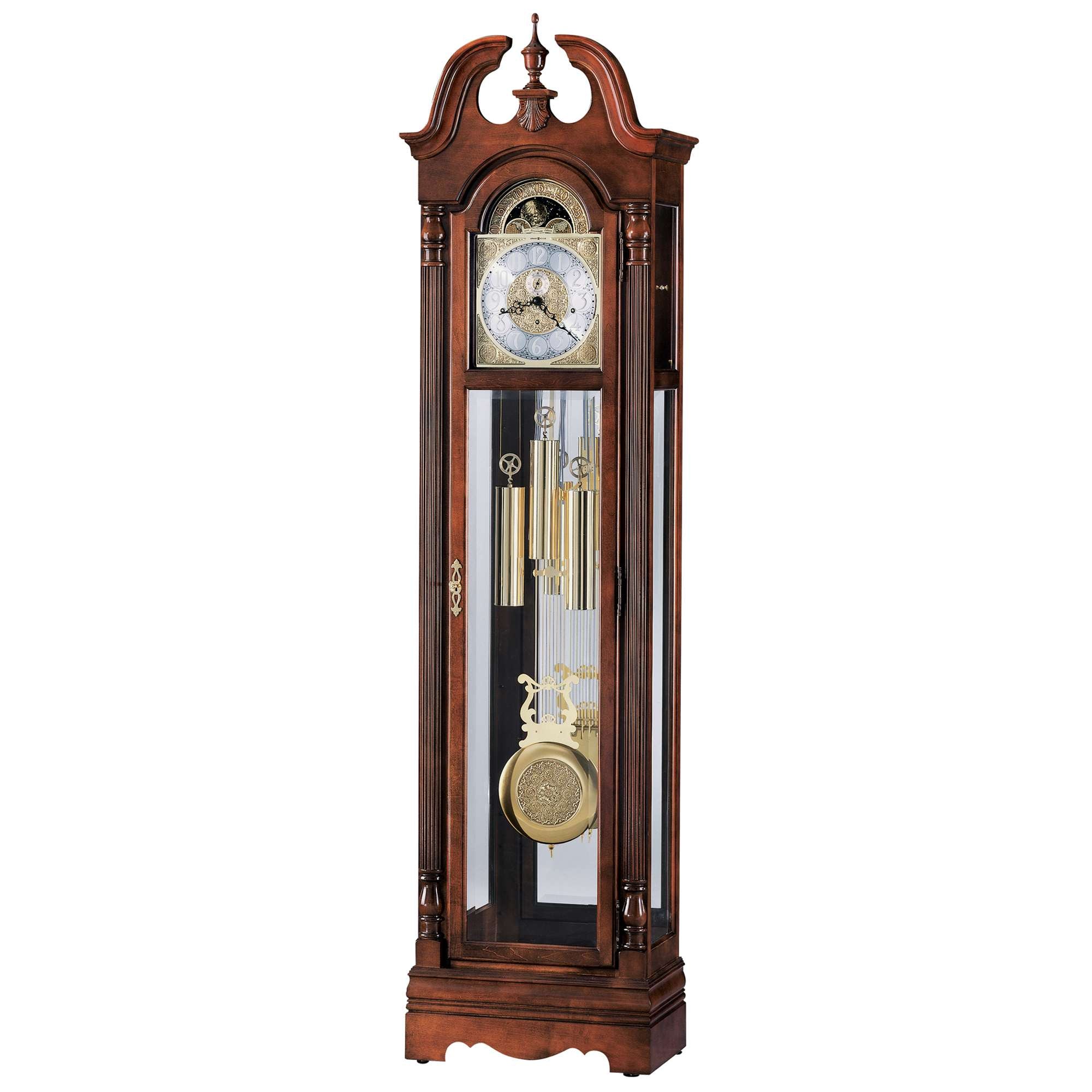 Tall, ornate wooden grandfather clock with a glass front