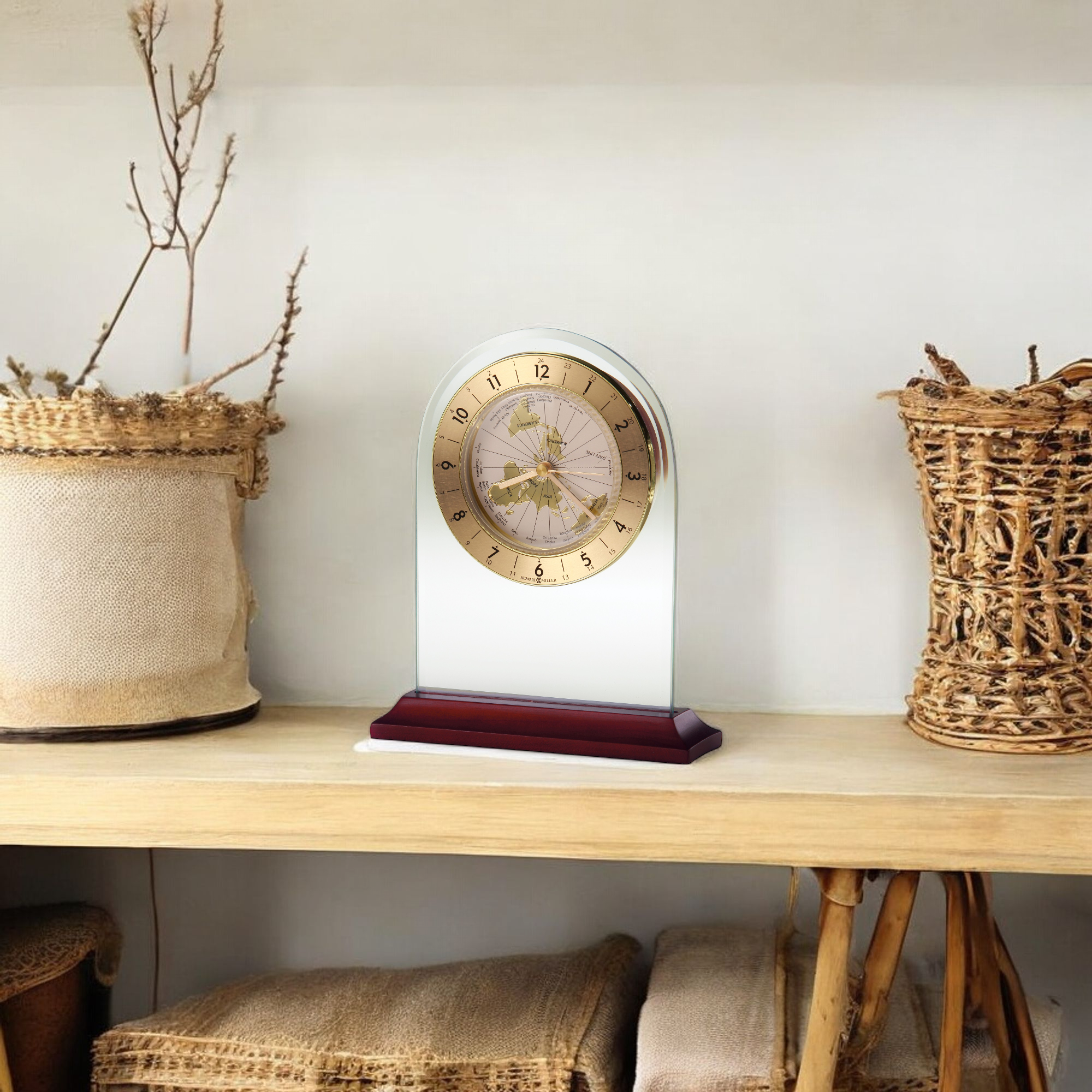 A decorative clock on a wooden shelf surrounded by woven baskets.