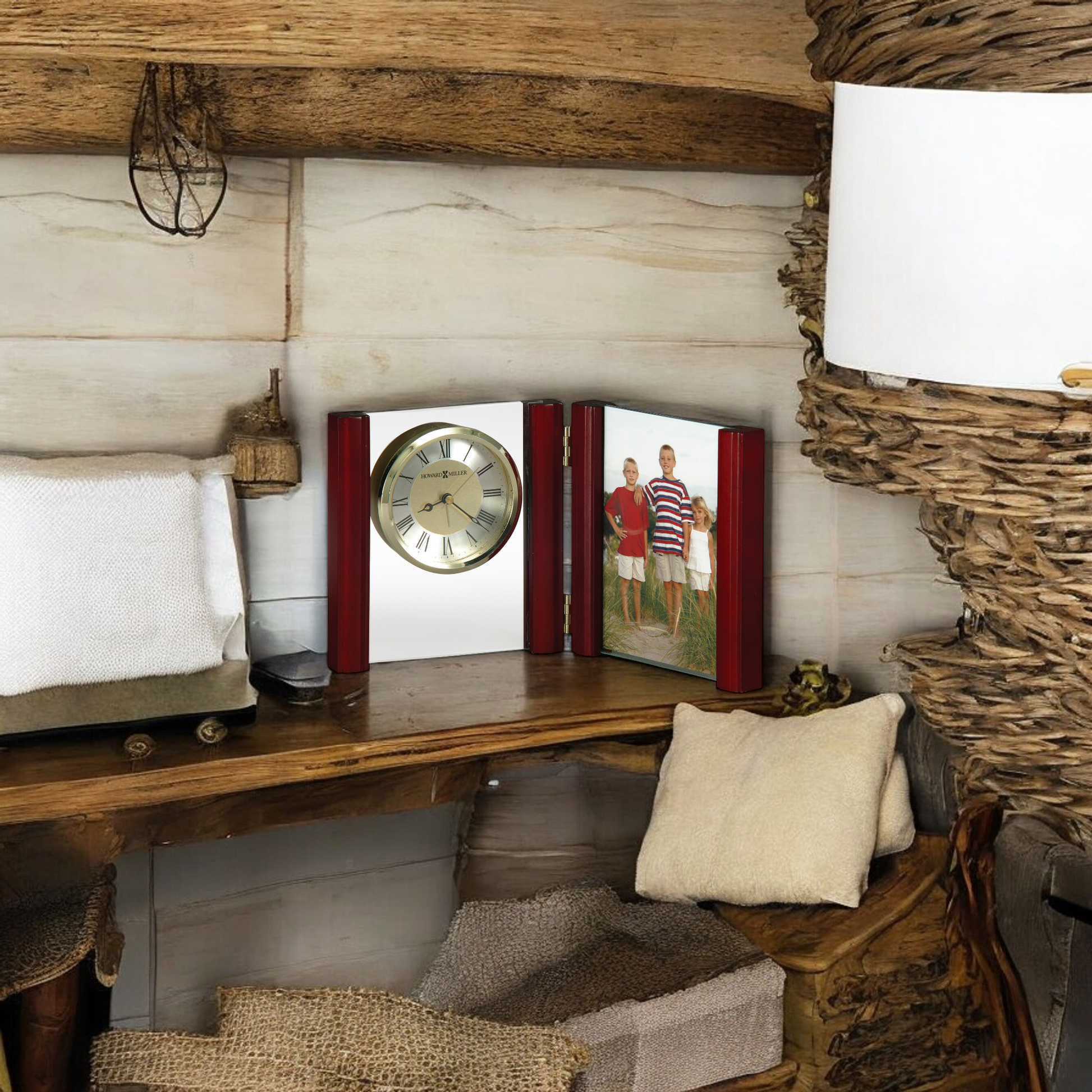 A cozy wooden shelf displaying a clock and a photo frame in a rustic setting.