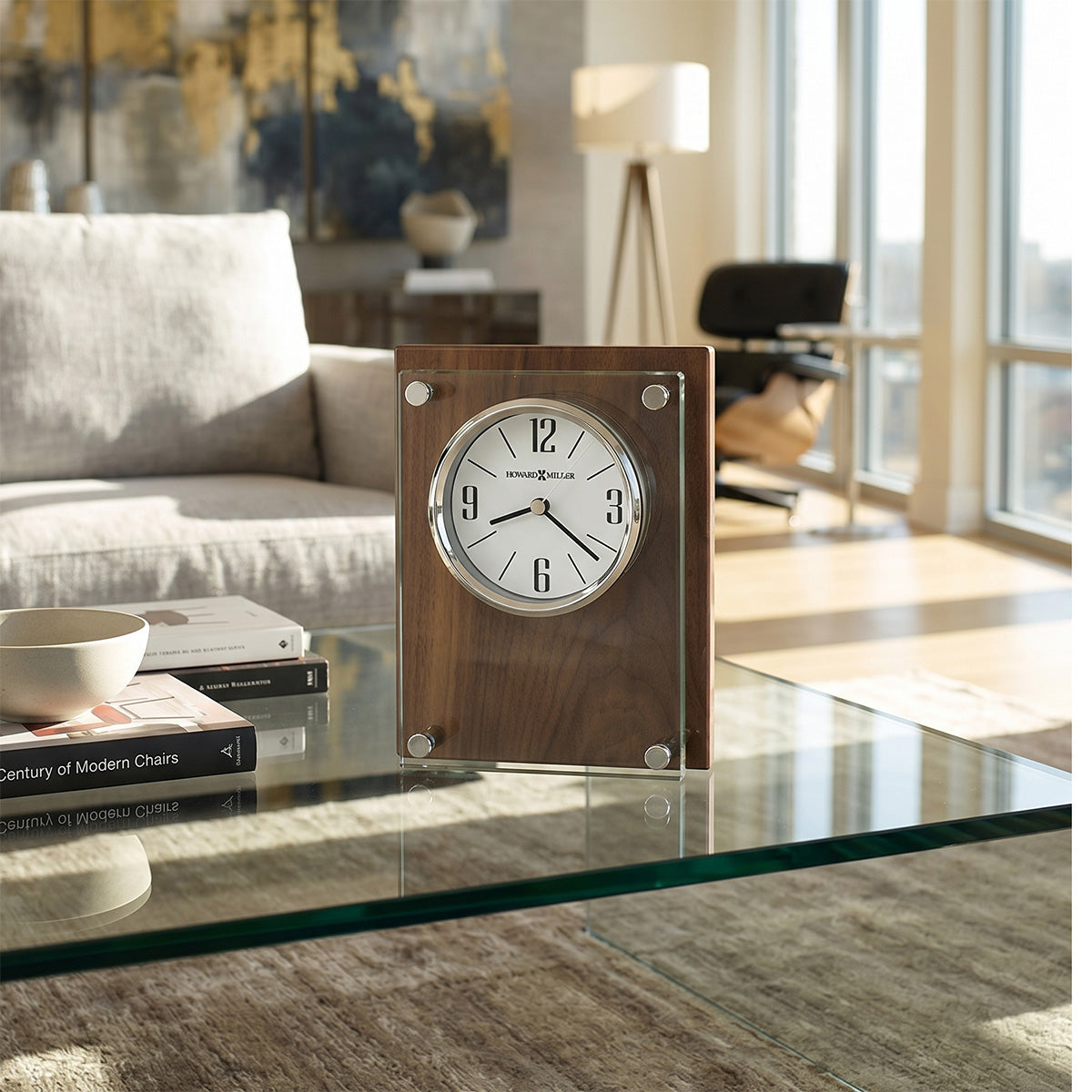 Wooden clock on a glass table in a living room setting