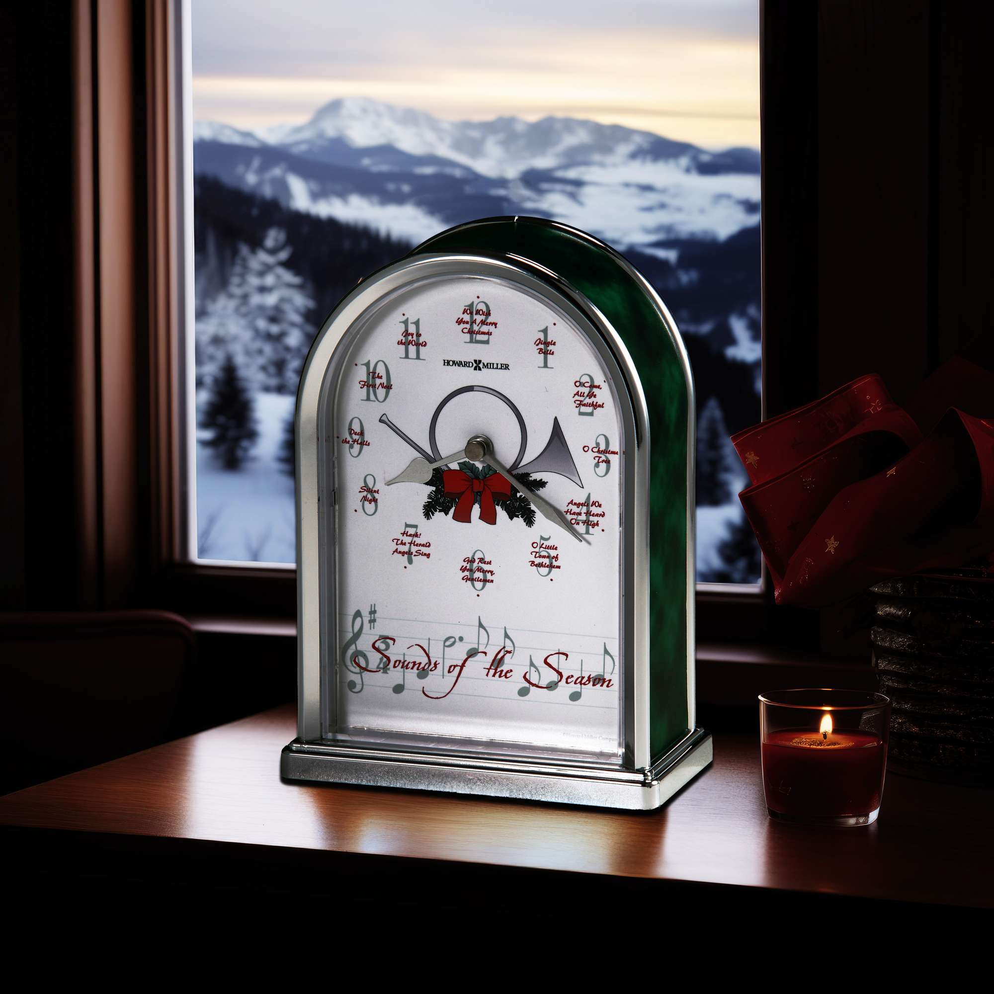 Decorative clock with holiday theme, set against a snowy mountain backdrop.