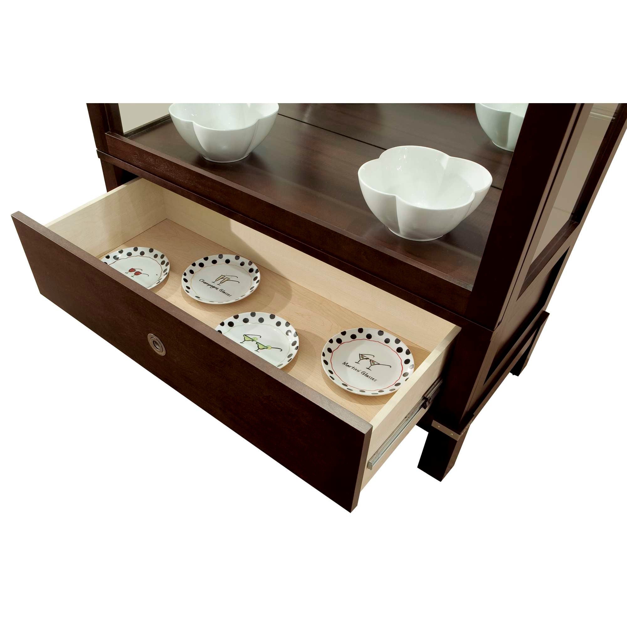 A wooden cabinet with an open drawer displaying decorative plates and bowls.