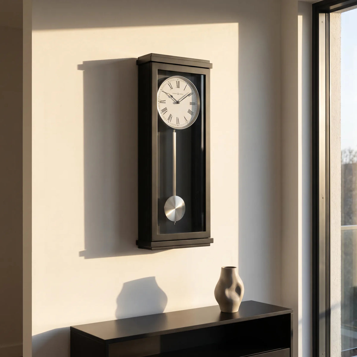 Howard Miller Alvarez Wall Clock, 26-inch, on the wall in a styled room