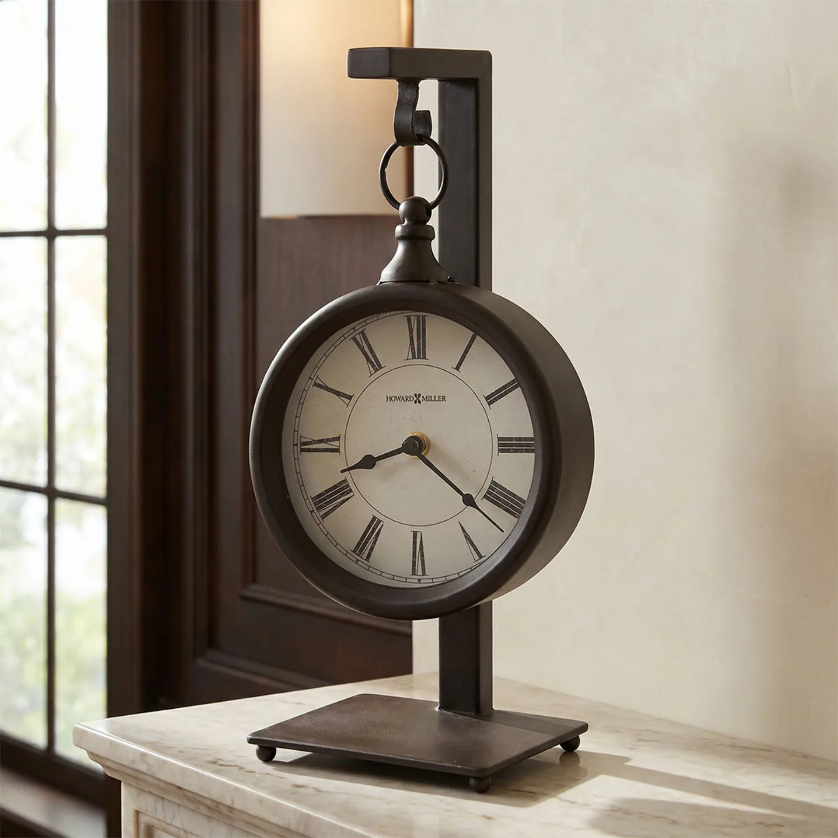 Howard Miller Loman Mantel Clock, 14-inch, on a mantel in a styled room