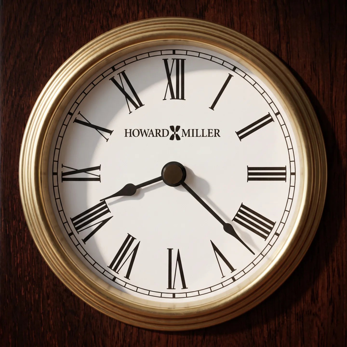 Howard Miller Rosewood Encore Bracket Tabletop Clock, close-up of the dial and finish detail