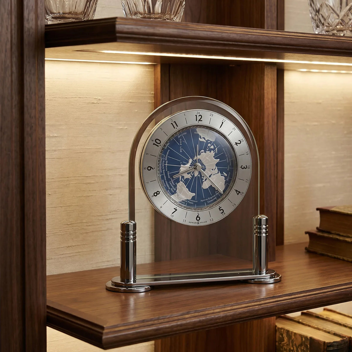 Howard Miller Discoverer Tabletop Clock, 6-inch, on a shelf in a styled room
