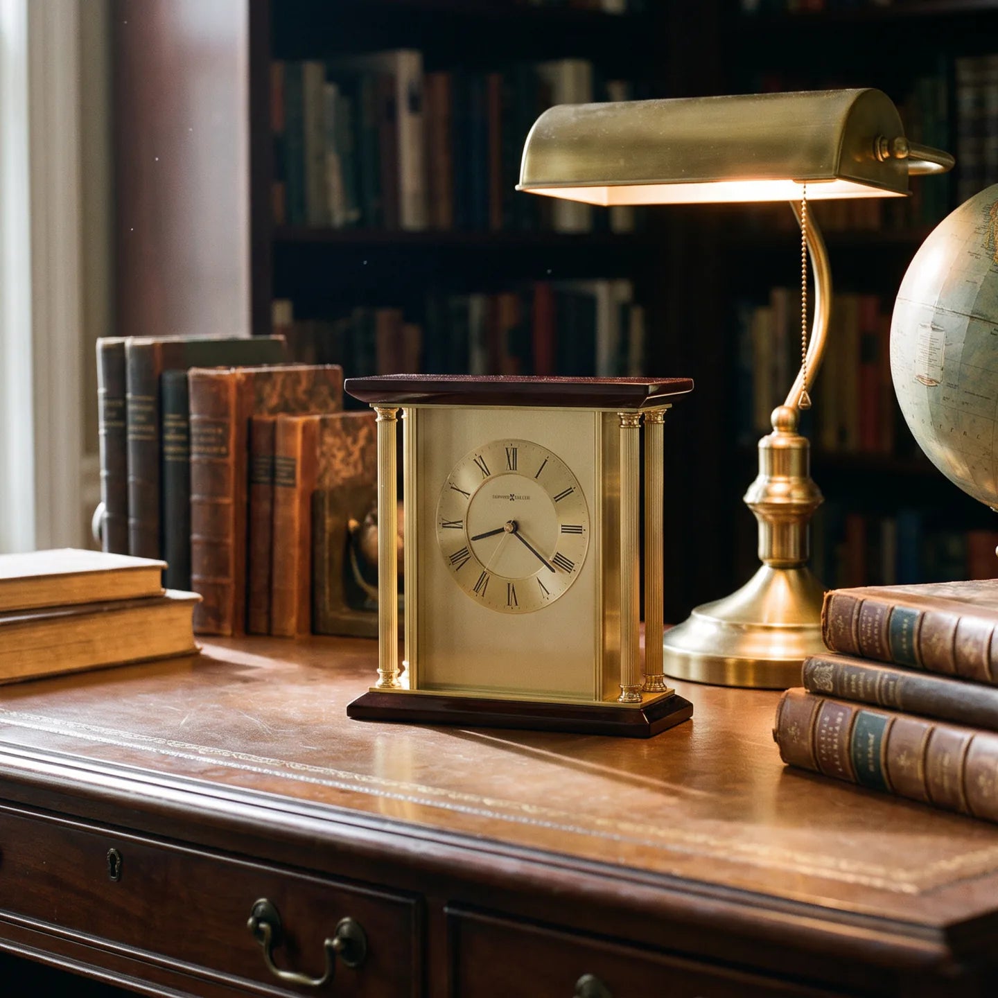 Howard Miller Carlton Tabletop Clock, 9-inch, on a shelf in a styled room