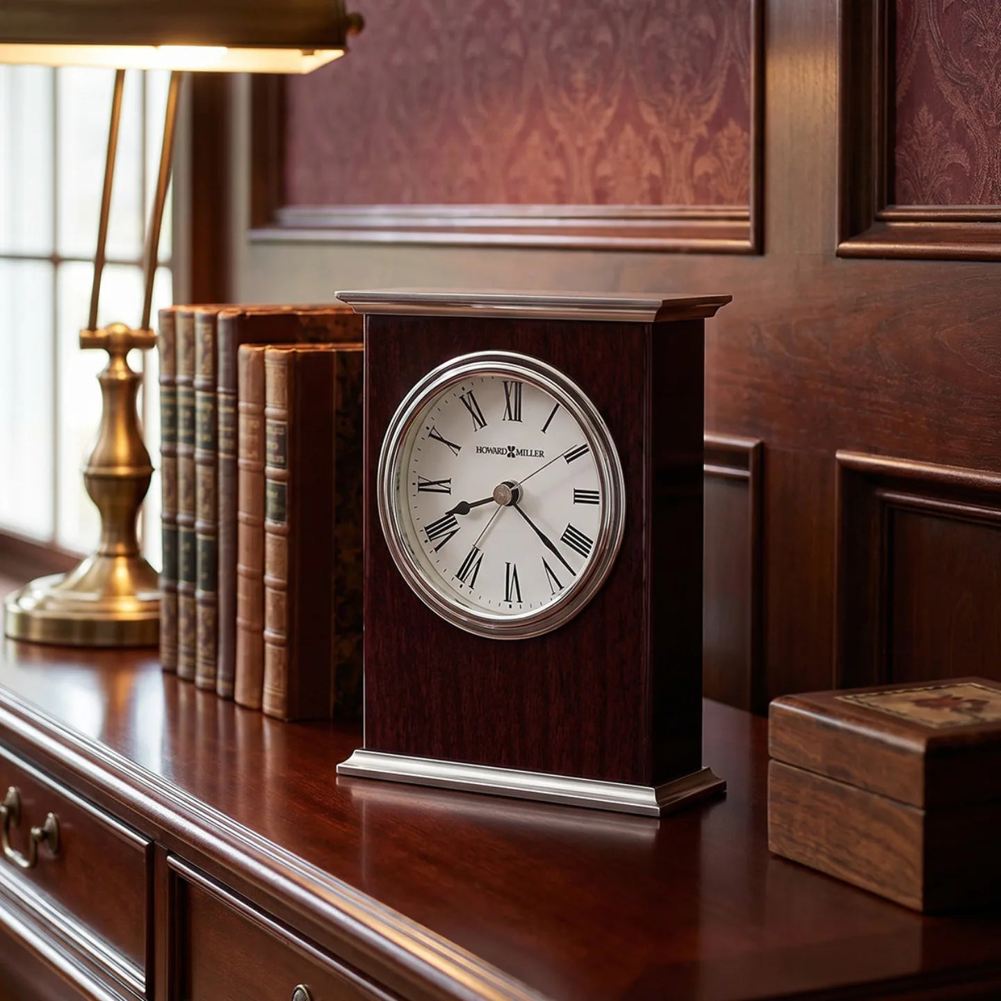 Howard Miller Kentwood Tabletop Clock, 6-inch, on a shelf in a styled room
