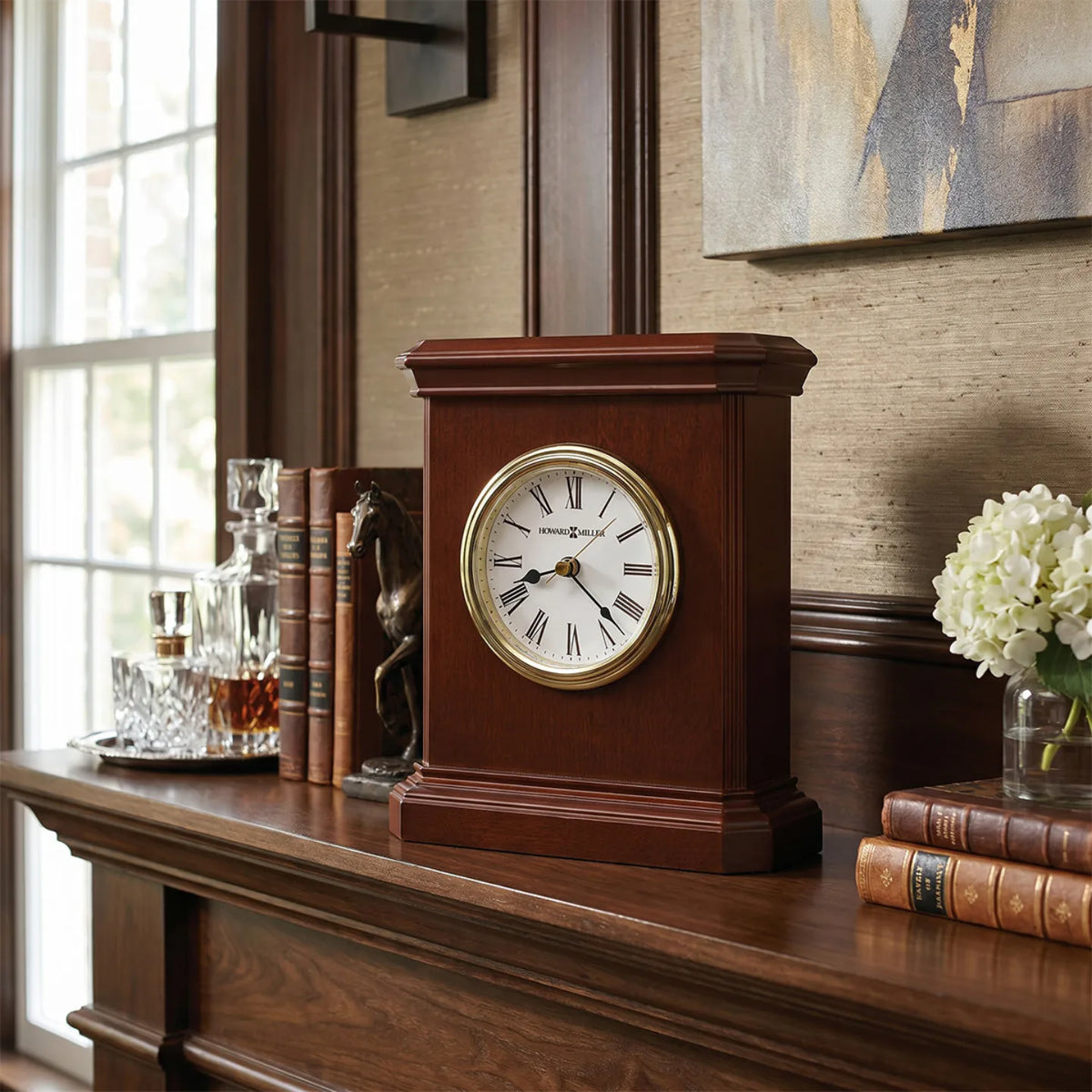 Howard Miller Windsor Carriage Tabletop Clock, 7-inch, on a shelf in a styled room