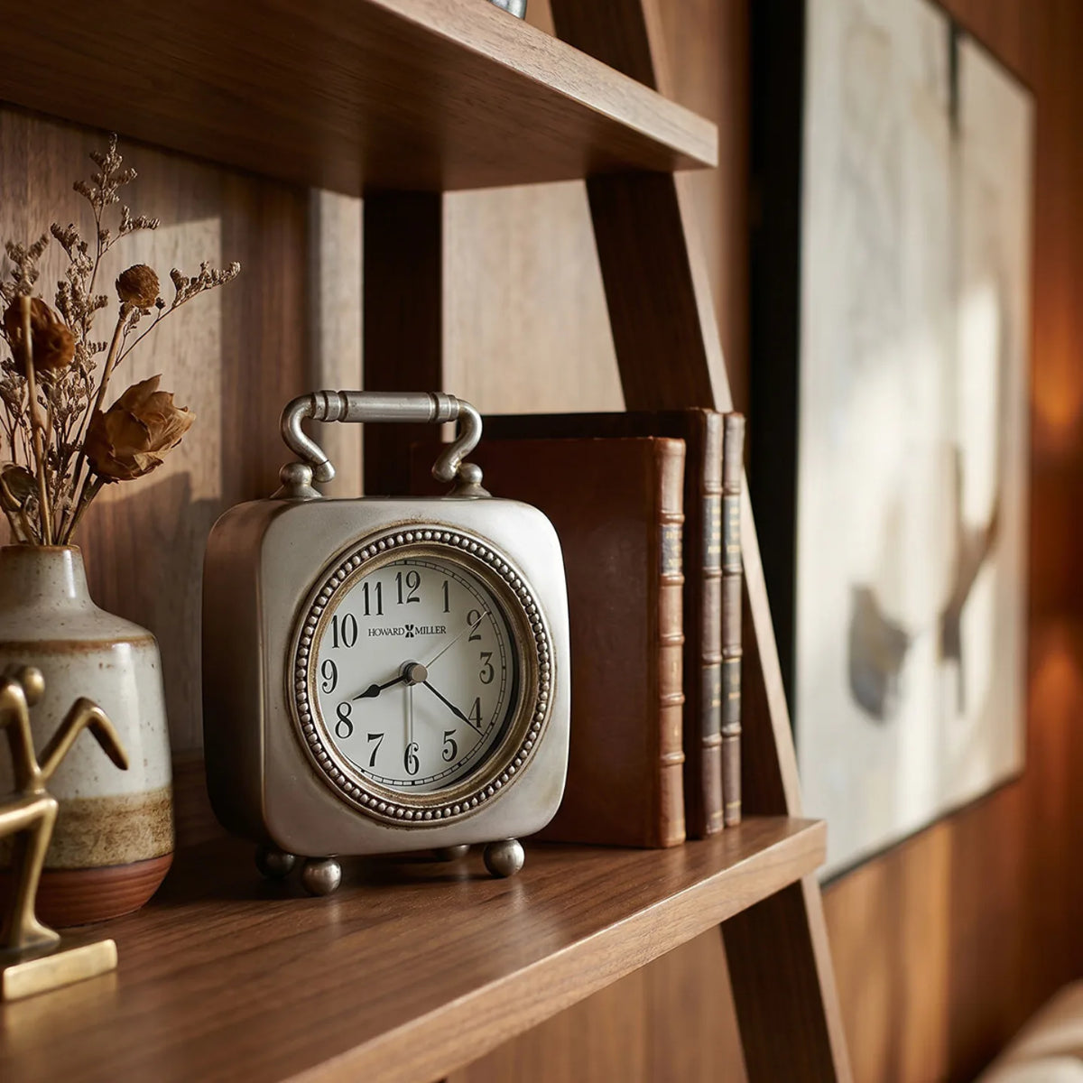 Howard Miller Kegan Tabletop Clock, 6-inch, on a shelf in a styled room
