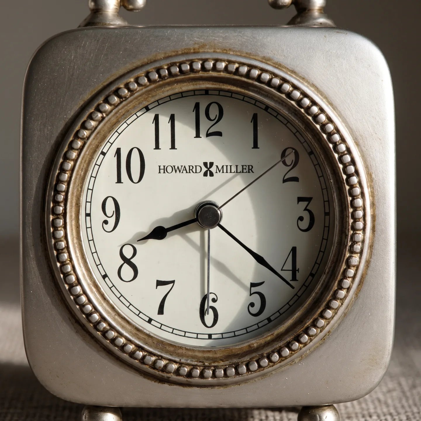 Howard Miller Kegan Tabletop Clock, close-up of the dial and finish detail