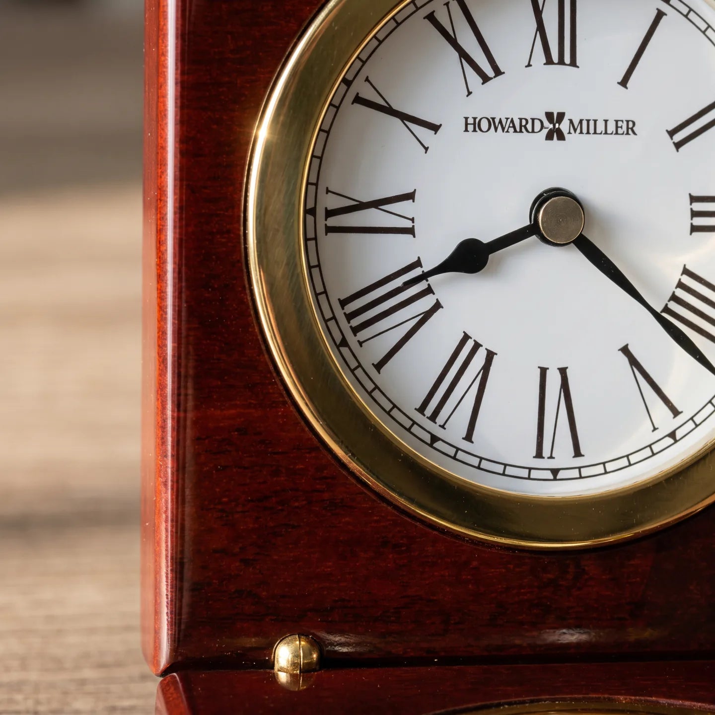 Howard Miller Pursuit Tabletop Clock, close-up of the dial and finish detail