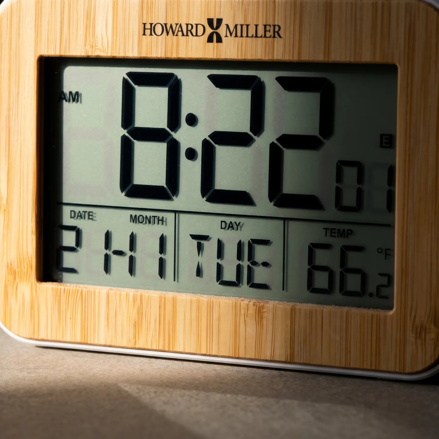Howard Miller Bamboo Box Alarm Clock, close-up of the dial and finish detail