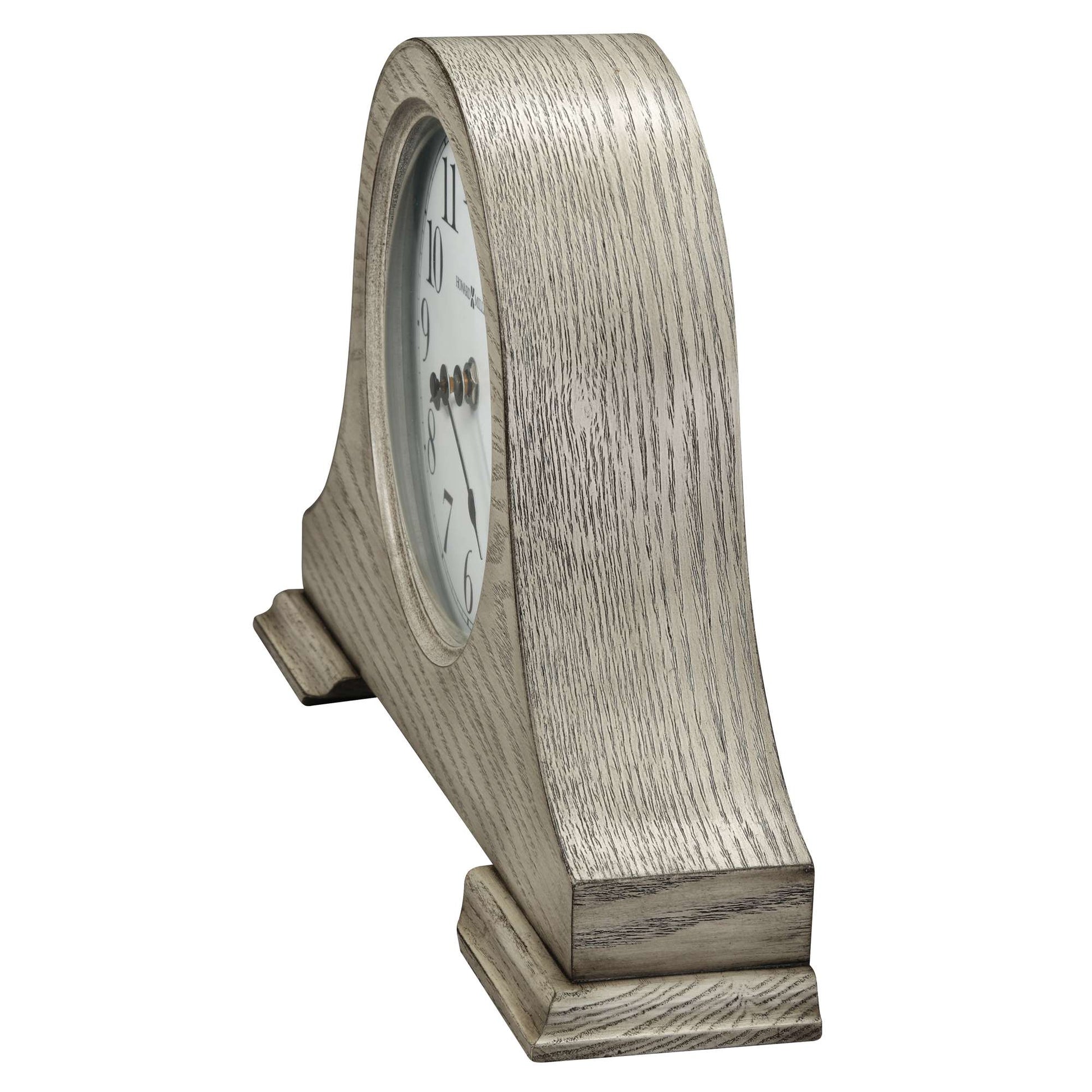 Side view of a vintage-style table clock with a wooden finish.