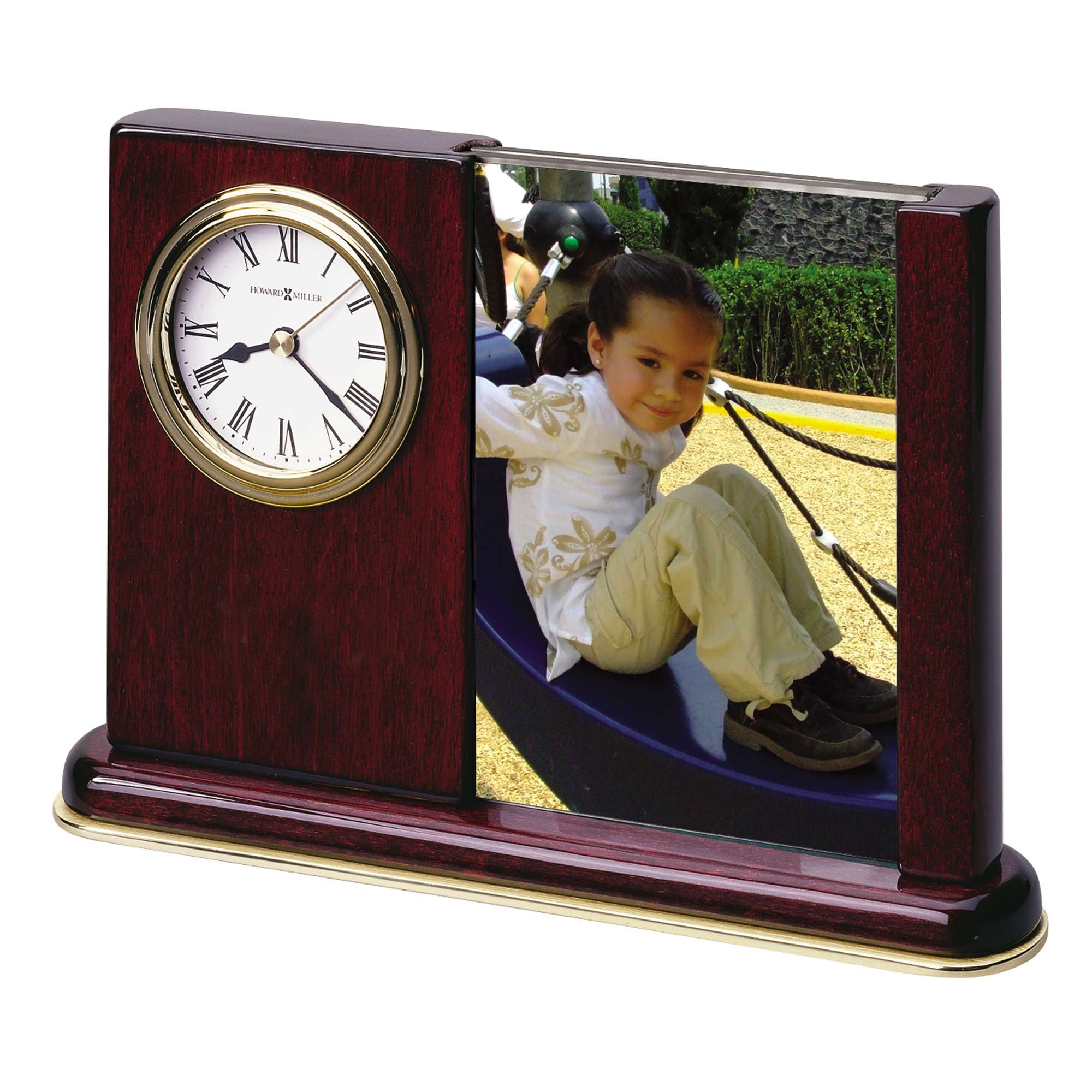 A wooden picture frame with a clock, featuring a photo of a child on a playground.