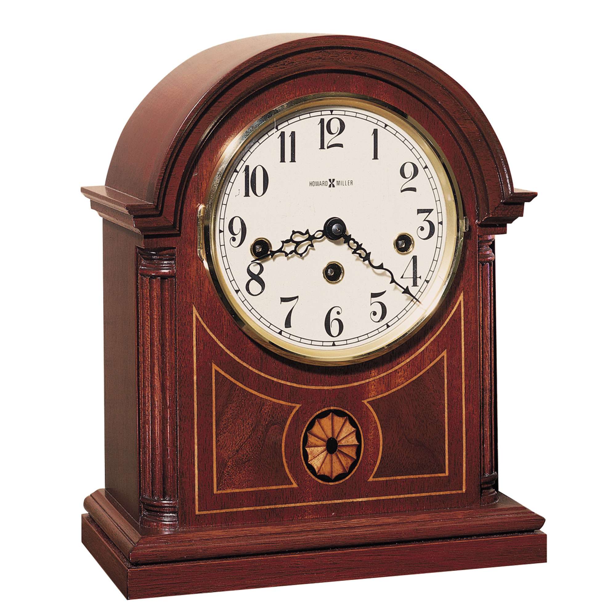 A vintage wooden mantel clock with an arch top, featuring Roman numerals and intricate details.