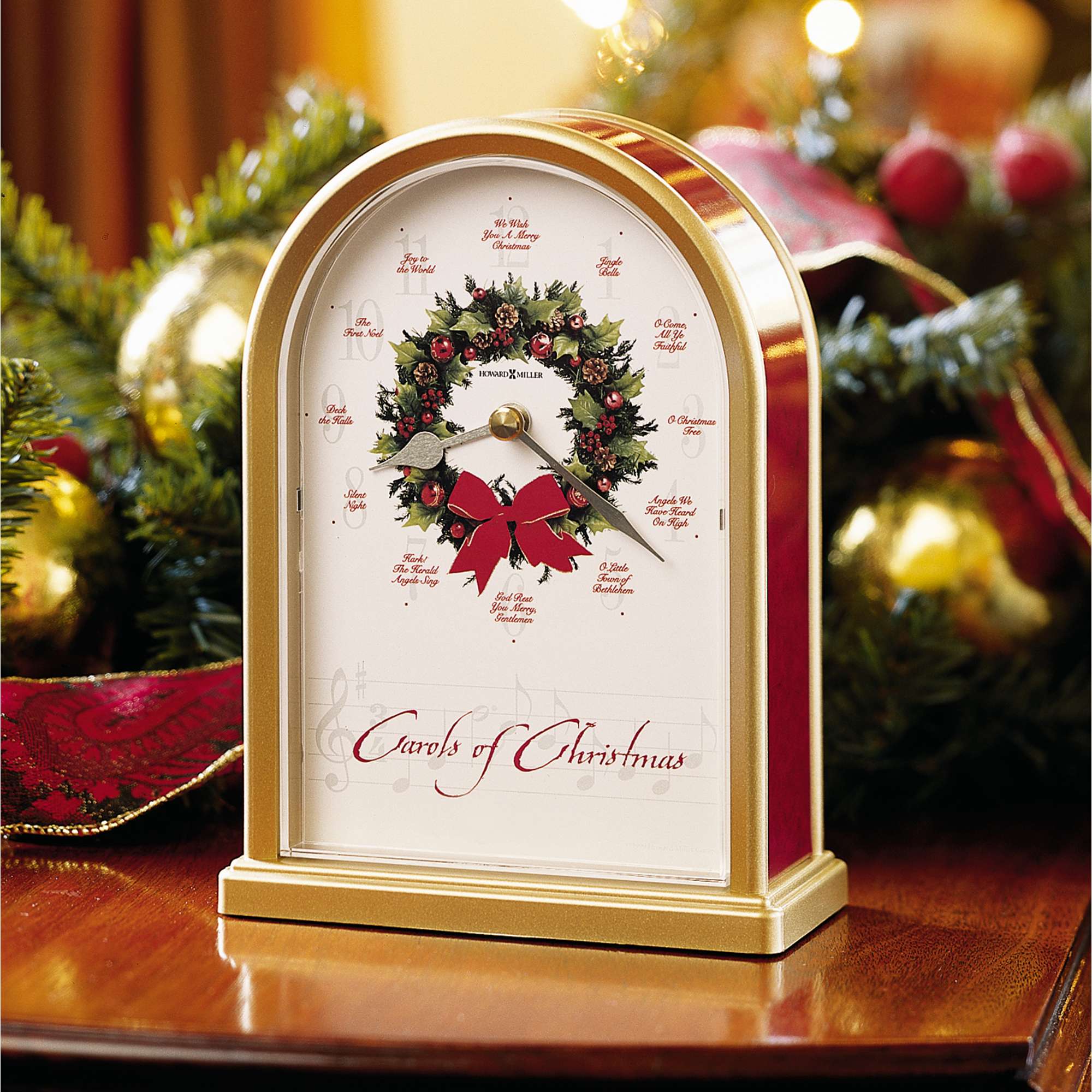 A decorative clock adorned with a festive Christmas wreath and ribbons.