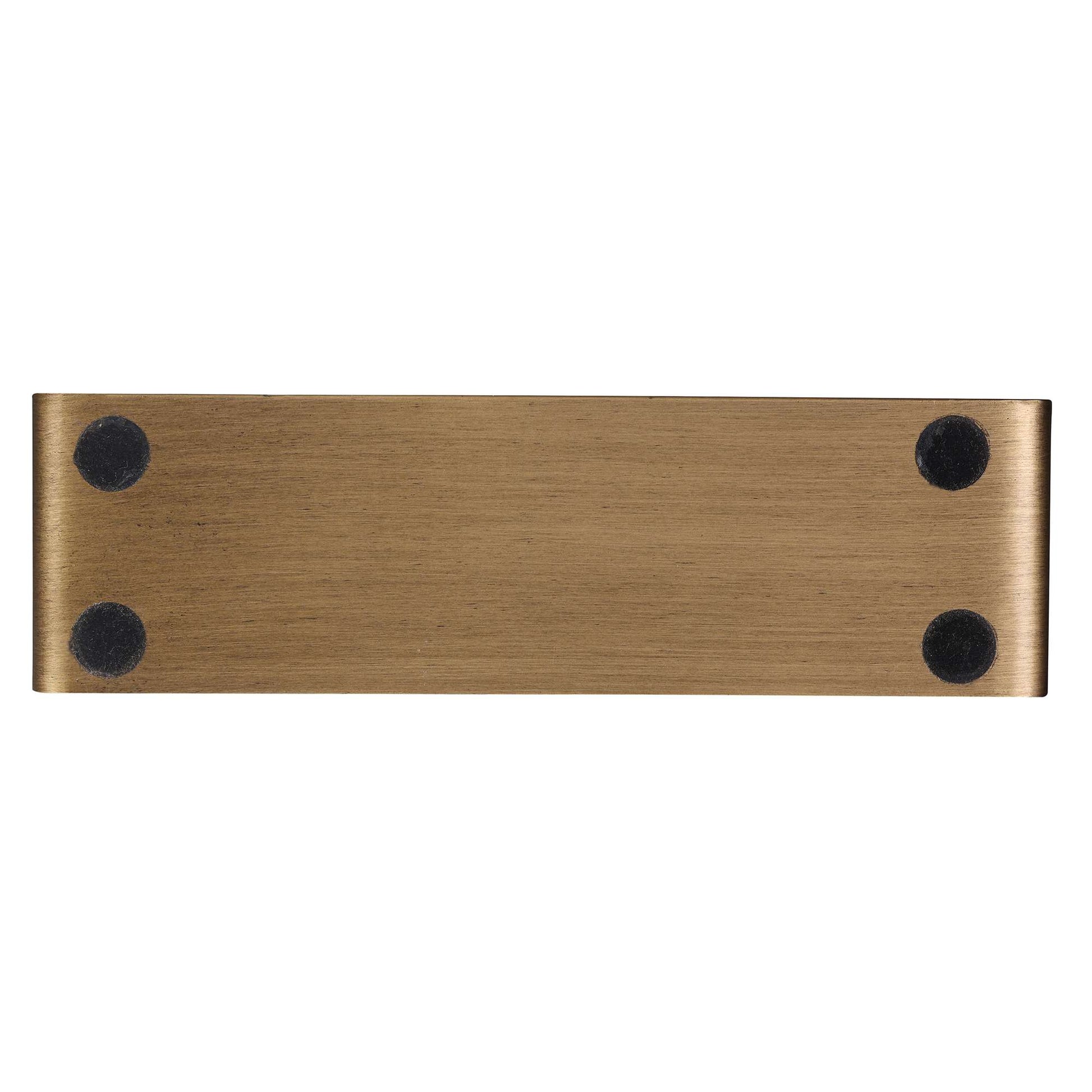 Brushed bronze metal plate with four circular black adhesive pads