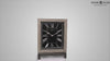 A decorative table clock with a black face and silver accents.