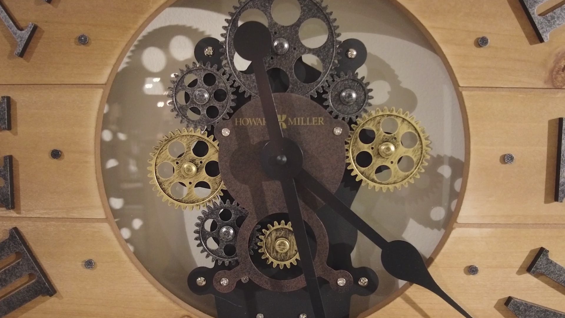 Close-up of a vintage clock mechanism with visible gears and clock hands.