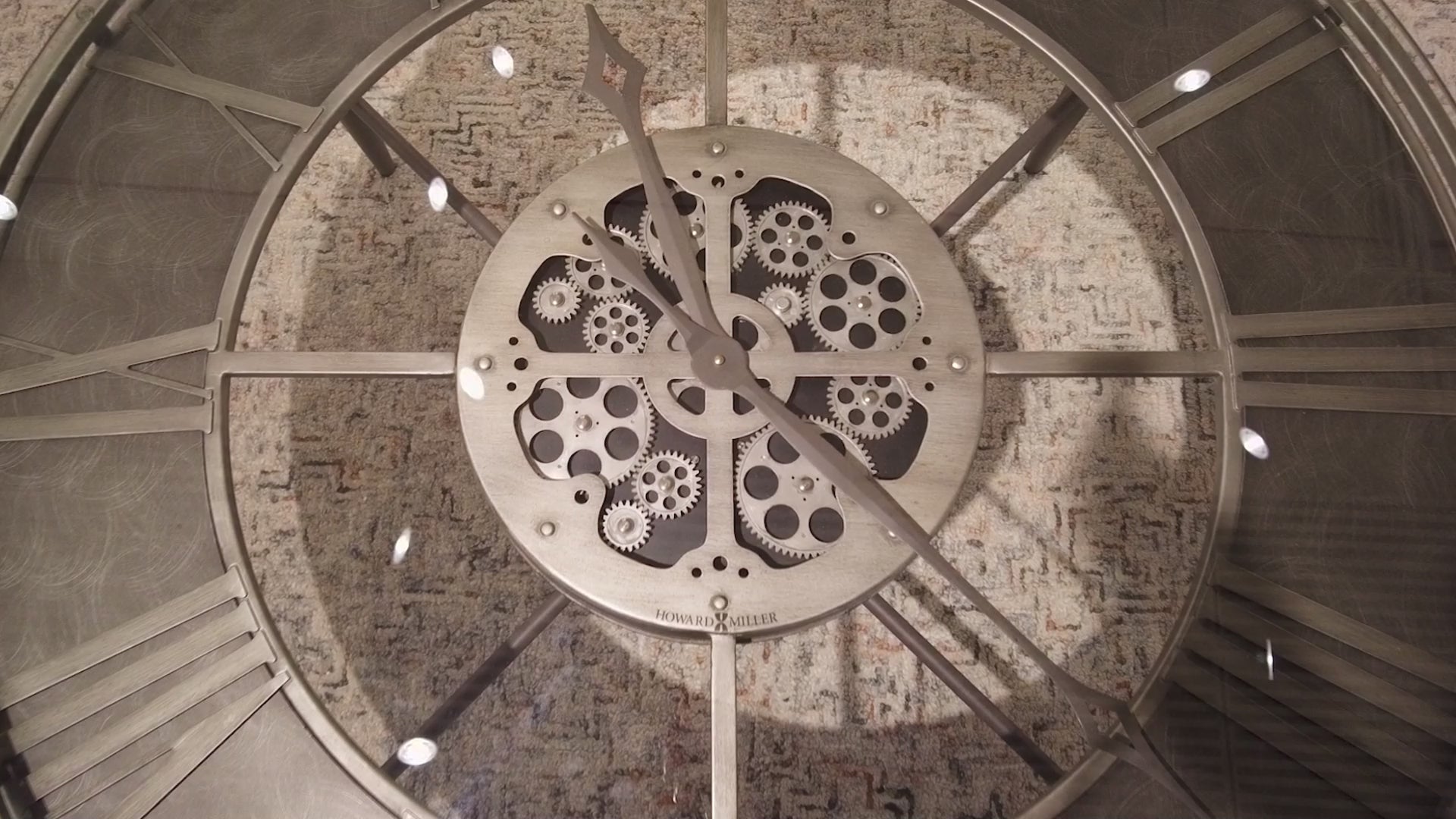 Close-up of a decorative clock mechanism with gears.
