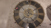 A large decorative wall clock with Roman numerals and a vintage design.