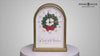 A decorative clock featuring a Christmas wreath and the text 'Countdown to Christmas' in a festive design.