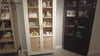 Display cabinets with various decorative items and tableware.