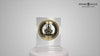 A decorative clock displayed on a pedestal, featuring a detailed design with gears and a gold-tone face.