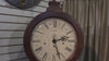 Antique wall clock with Roman numerals and decorative detailing