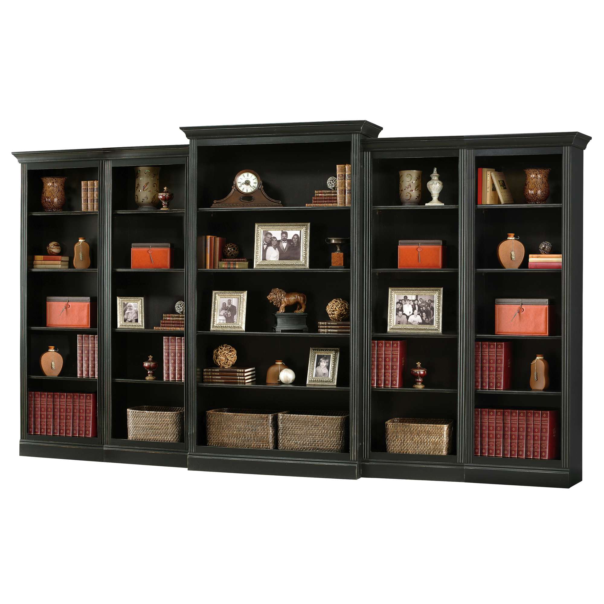 A black wooden bookshelf with multiple shelves displaying books, decorative items, and framed photographs.