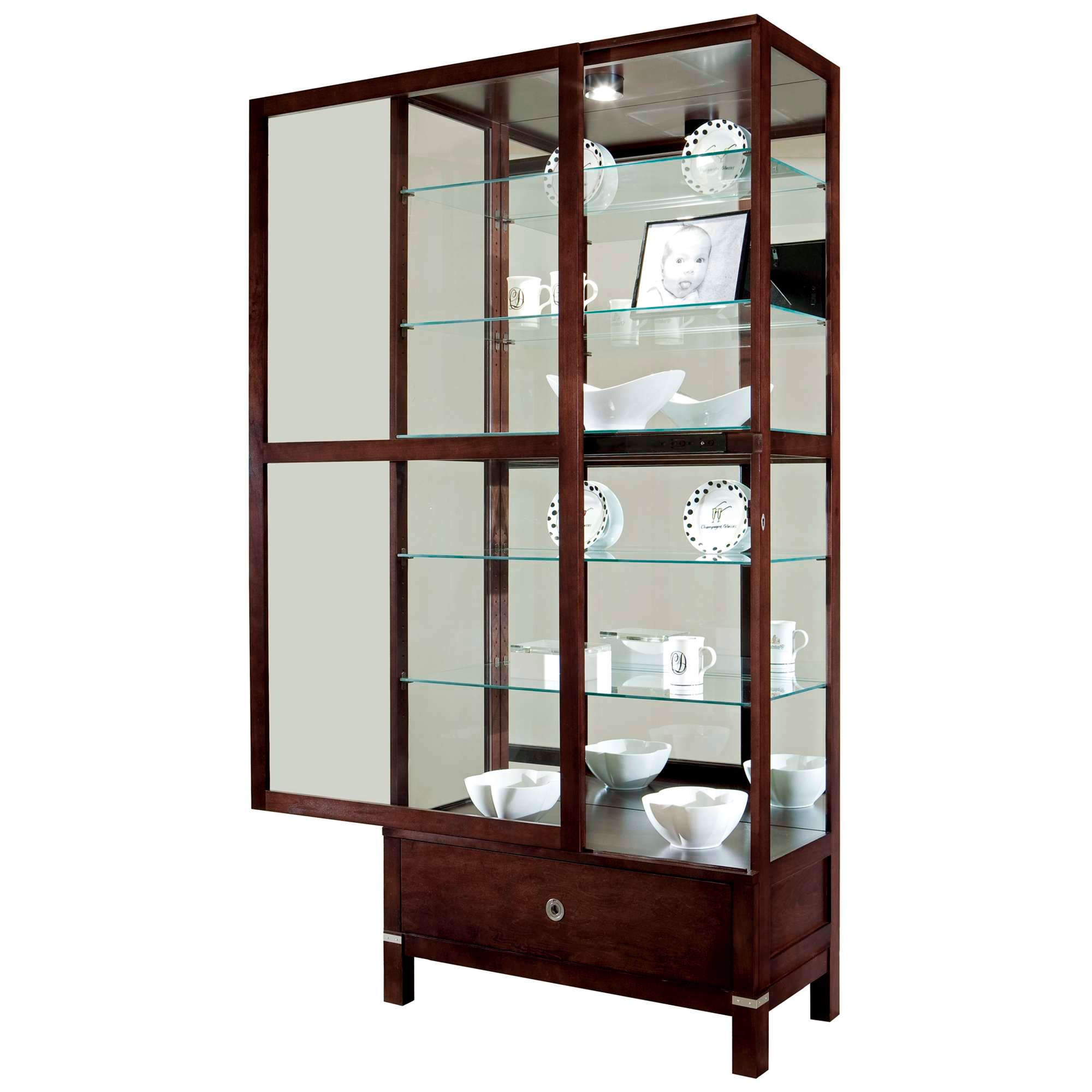 Wooden display cabinet with glass shelves, showcasing decorative tableware.