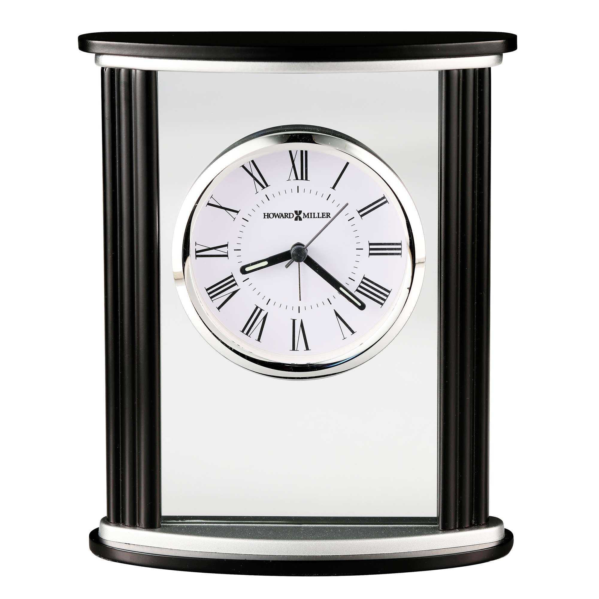 A decorative tabletop clock with Roman numerals and a mirrored surface.